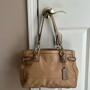 Coach tan triple compartment shoulder bag.